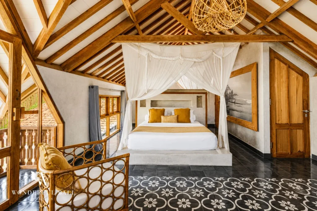 Master bedroom with canopy bed and vaulted timber ceiling at a villa in Canggu, Bali