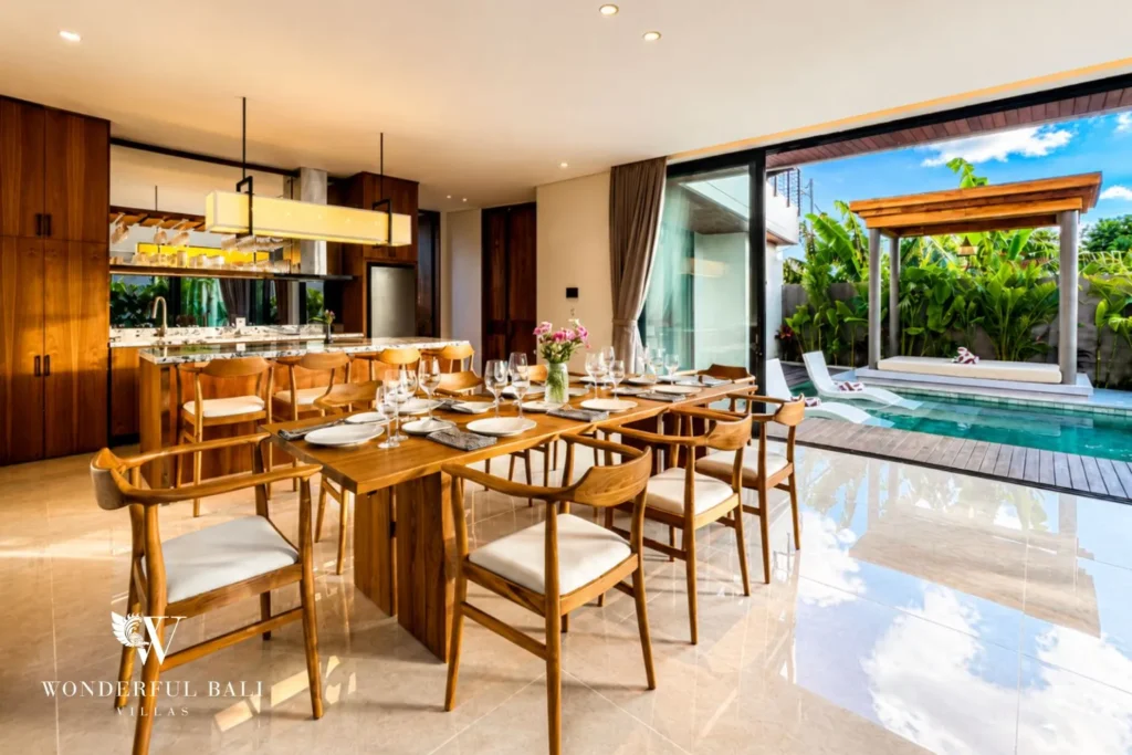 Open-plan living and dining with glass walls and pool view at villa in Umalas, Bali