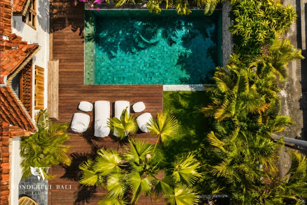 Aerial view of pool, loungers and garden at a villa in Canggu, Bali
