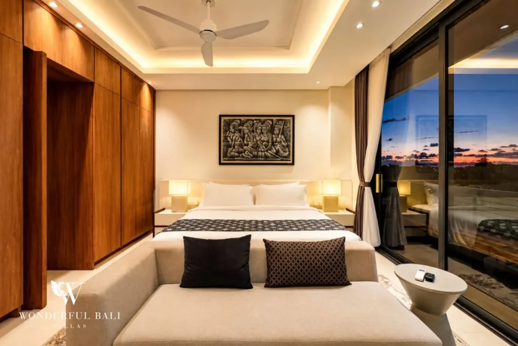 Living area with sofa, TV and timber feature wall at villa in Umalas, Bali