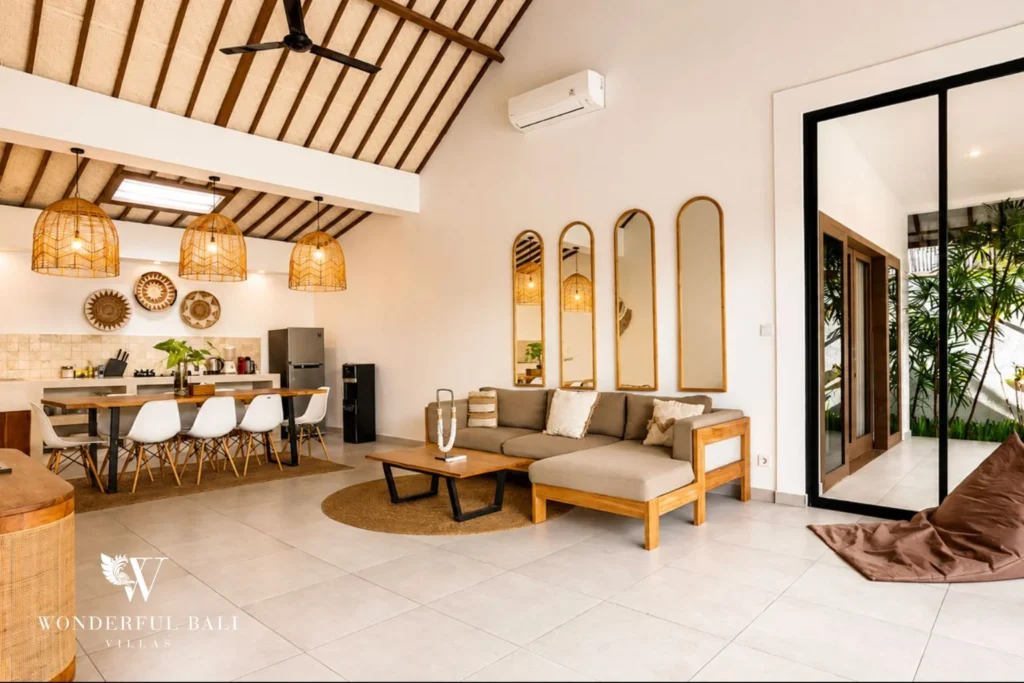 Open-plan living and dining area with high ceiling at villa in Umalas, Bali