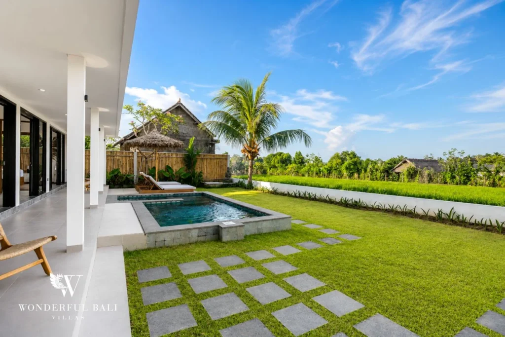 Private pool with bale and garden stepping stones at villa in Ubud, Bali