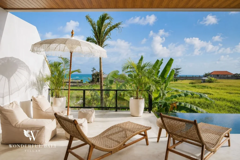 monthly villa rental cemagi — terrace sun loungers rice paddy view