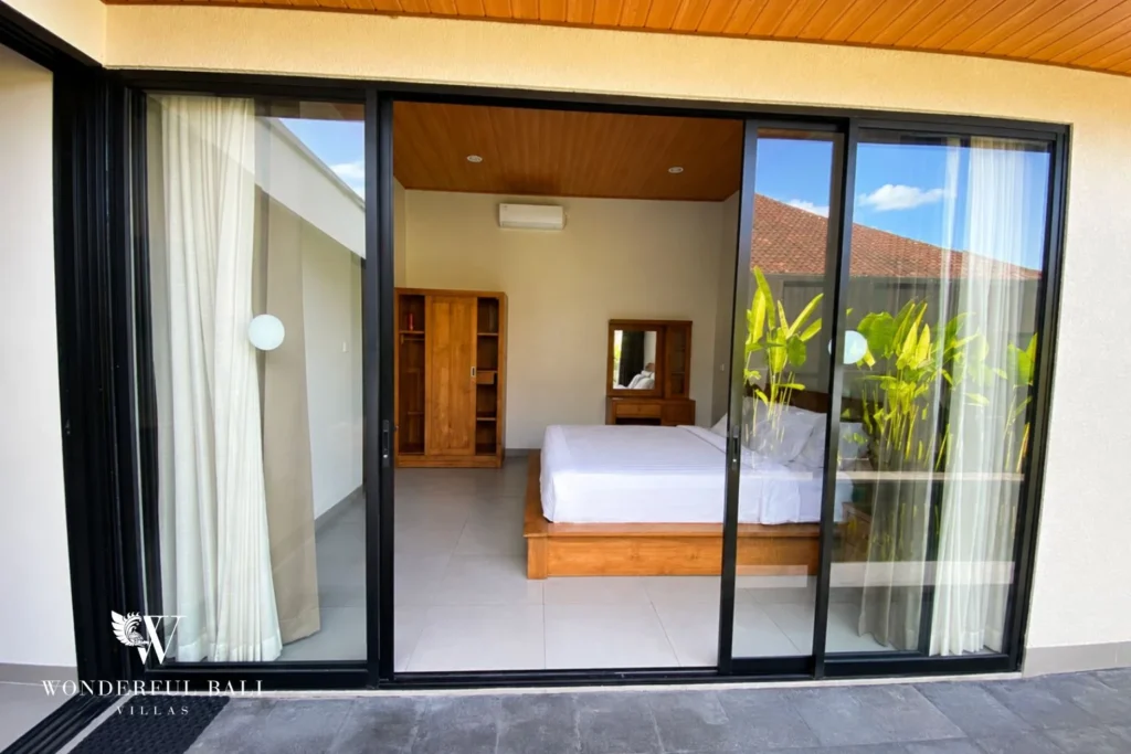 Master bedroom with direct pool access at villa in Canggu, Bali