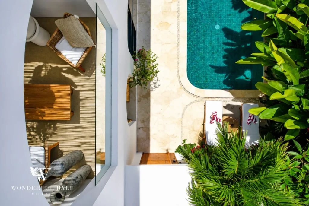 Outdoor garden nook with arches beside the pool at villa in Umalas, Bali