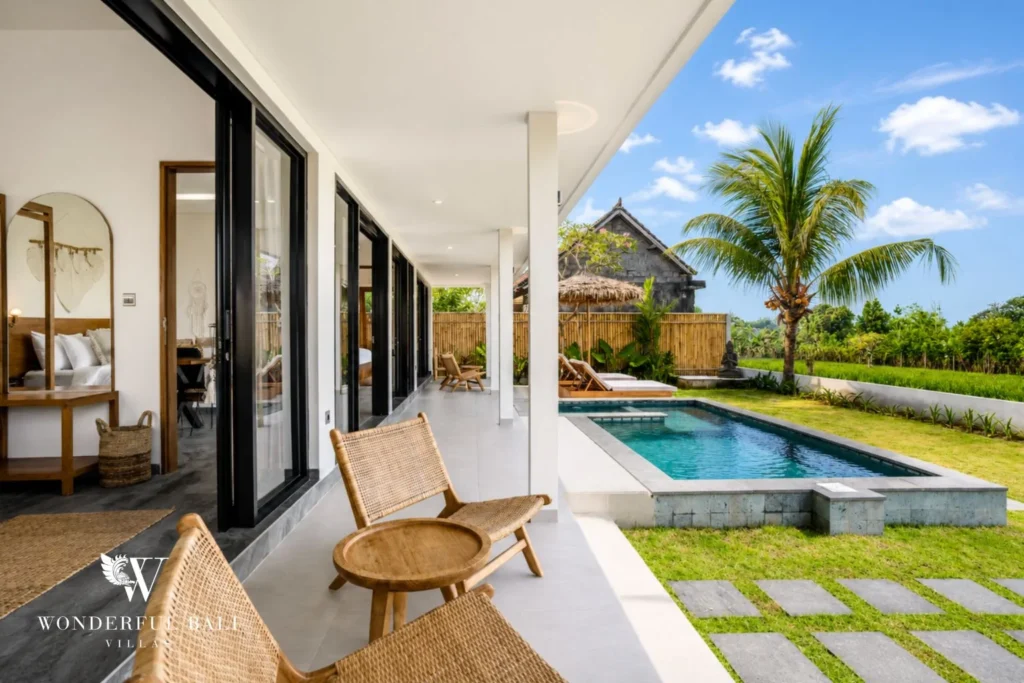 Private pool with sun loungers and rice-field view at villa in Ubud, Bali