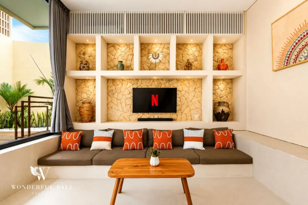 3BR villa for monthly rent Jimbaran — sunken living room with stone feature wall