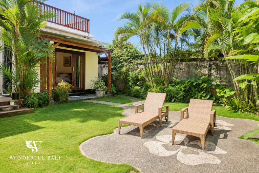 monthly villa rental sanur — tropical garden sun loungers