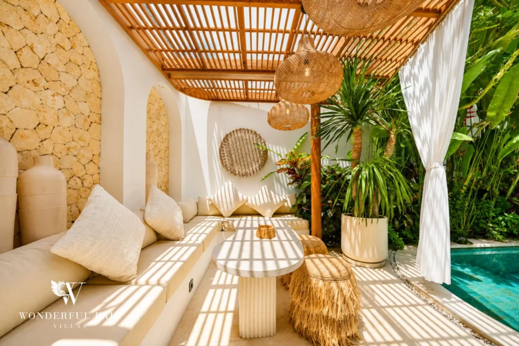 Living lounge with arches, woven decor and daybed at villa in Umalas, Bali