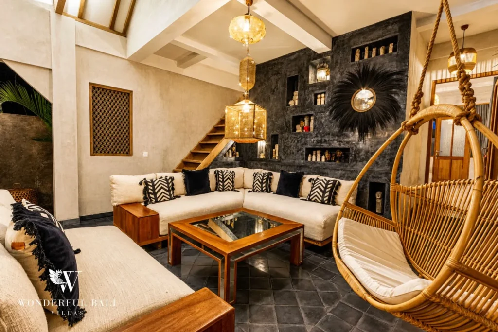 Living lounge with hanging egg chair and sofa at a villa in Canggu, Bali