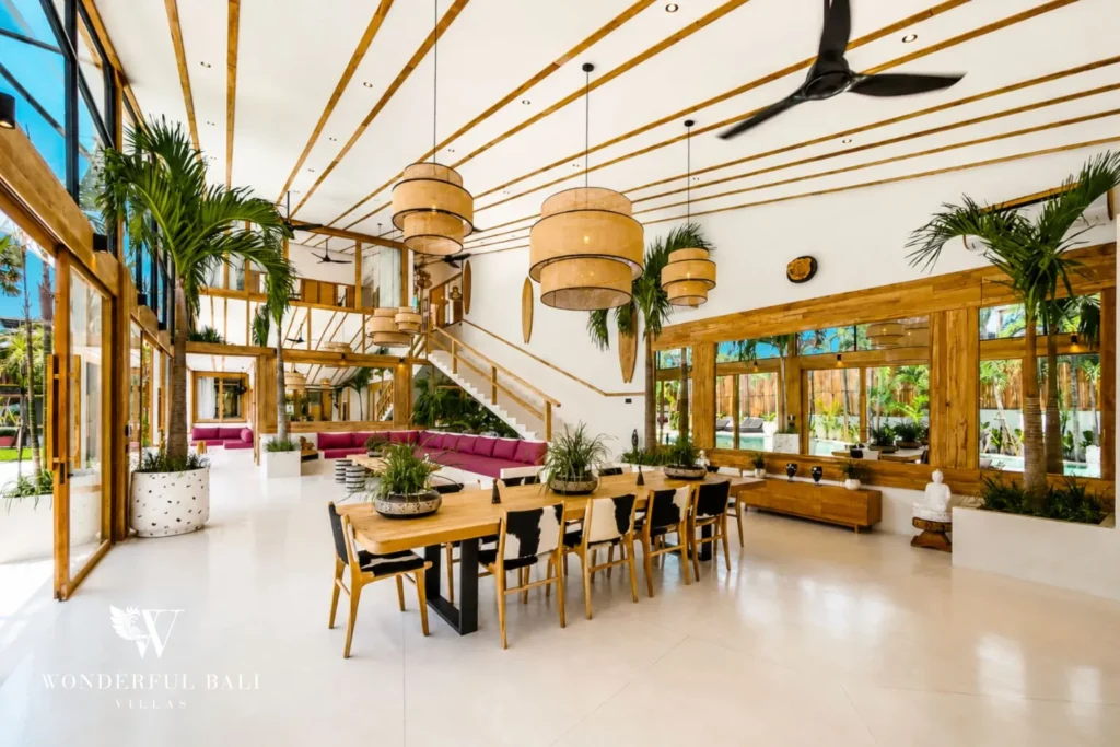 Open-plan living and dining with staircase at family villa in Umalas, Bali