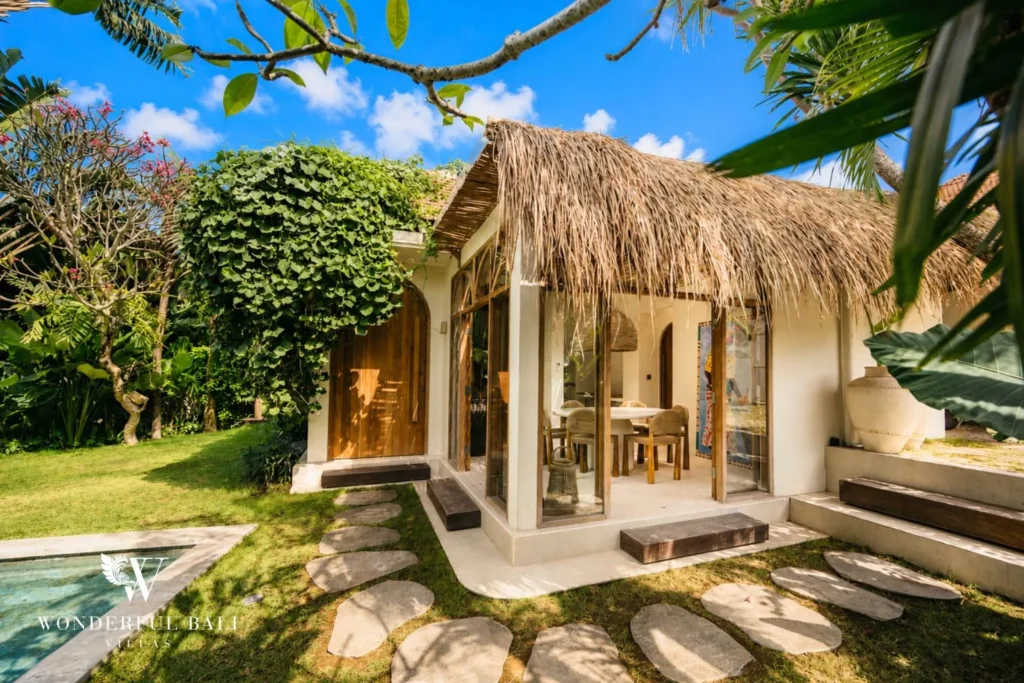 Outdoor thatched bale set in the tropical garden at villa in Berawa, Bali