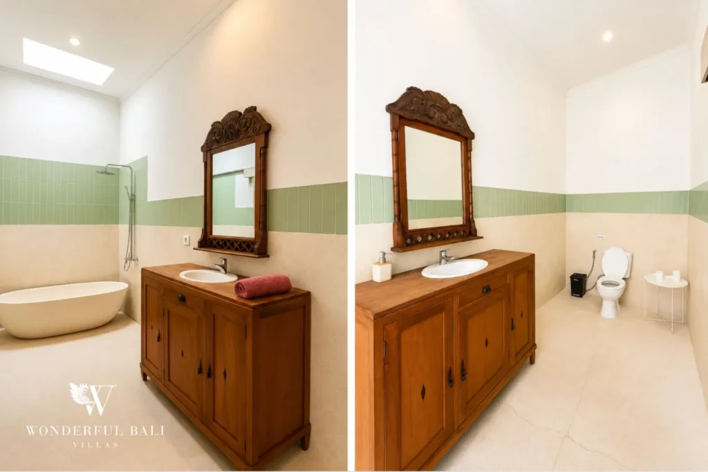 Bathroom with twin mirrors and carved wooden vanity cabinet at villa in Canggu, Bali
