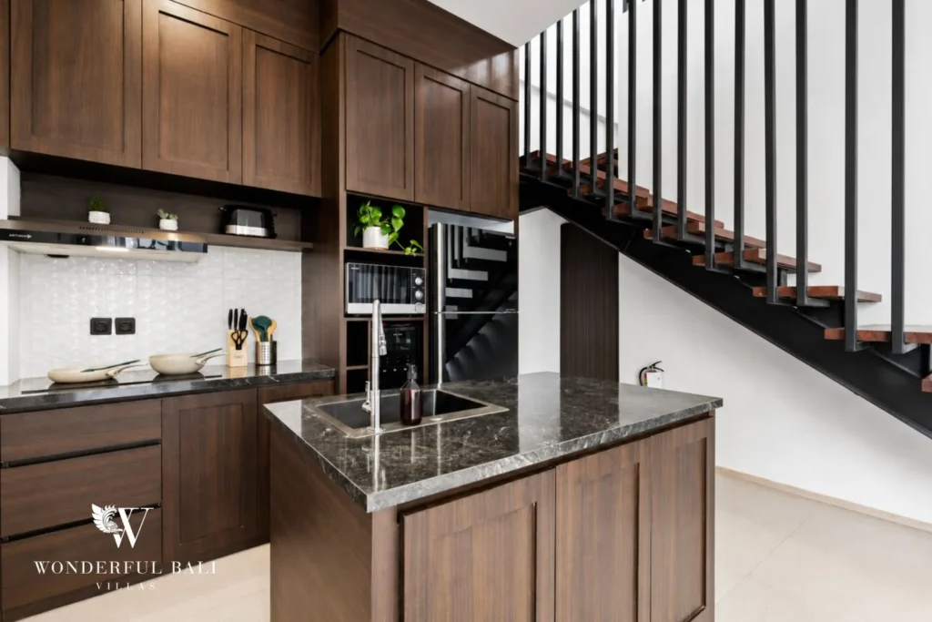 monthly villa rental pererenan — wooden kitchen with island