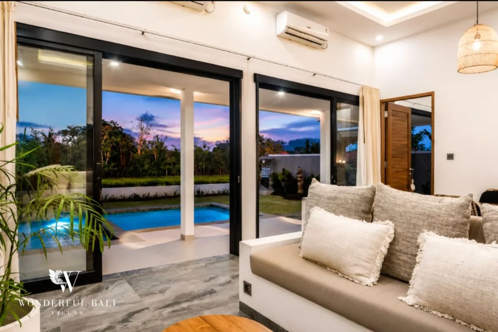 Lounge opening to the pool at dusk at villa in Ubud, Bali