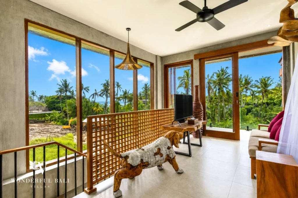 Living area with greenery views at a 4-bedroom ocean-view villa in Seseh, Bali