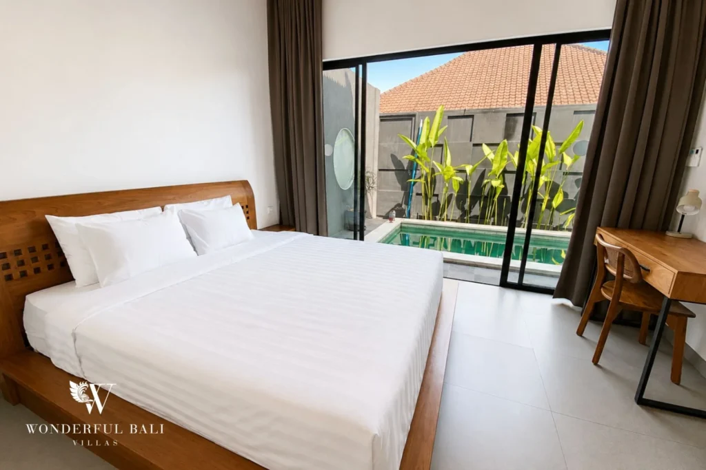 Second bedroom with work desk and pool view at villa in Canggu, Bali