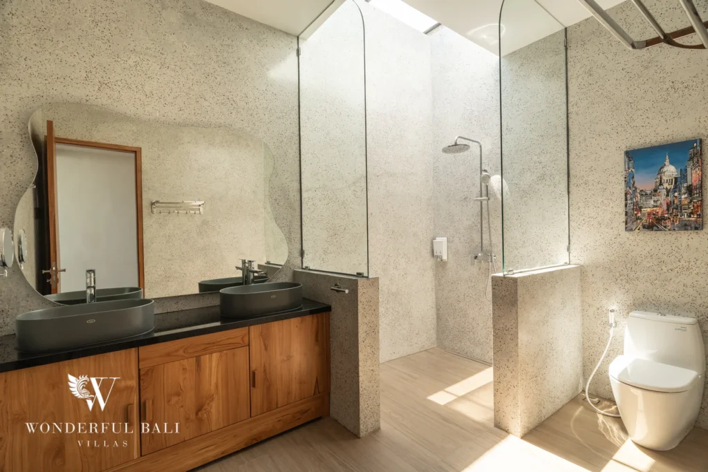 Bathroom with marble double vanity and shower at villa in Umalas, Bali