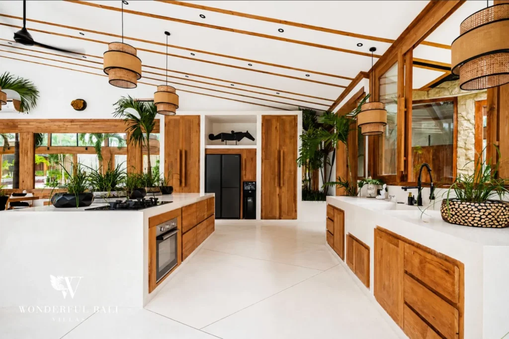Kitchen island beneath a bamboo vaulted ceiling at family villa in Umalas, Bali