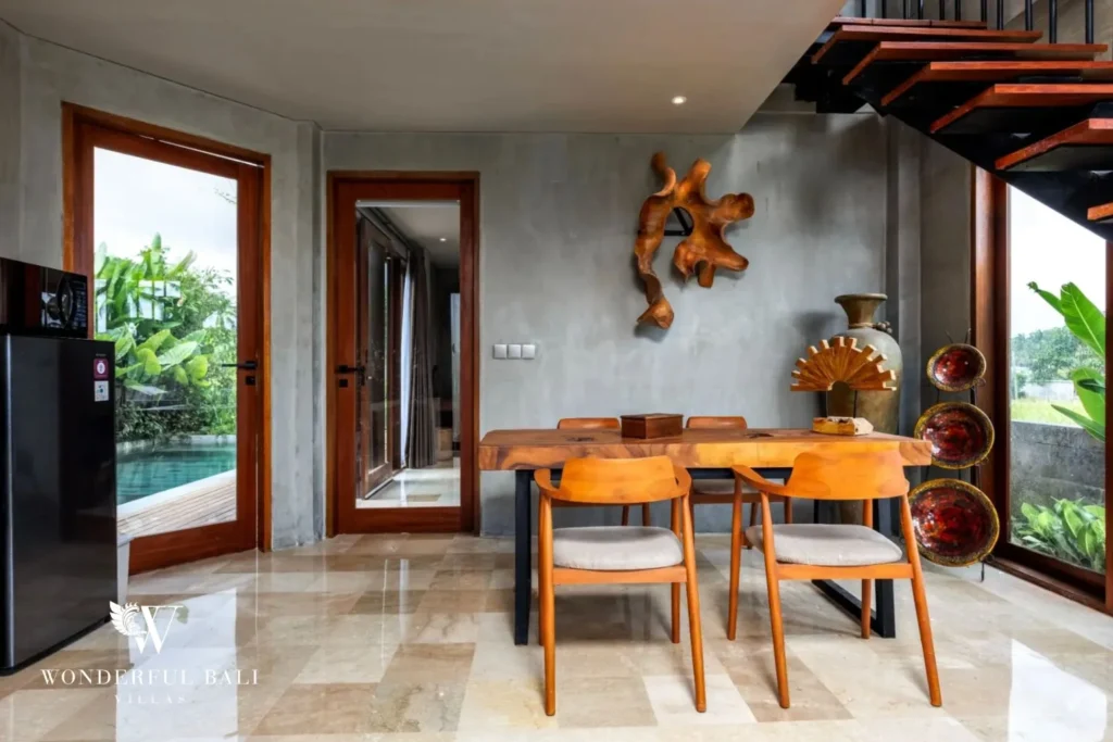 Living and dining space at a 4-bedroom ocean-view villa in Seseh, Bali
