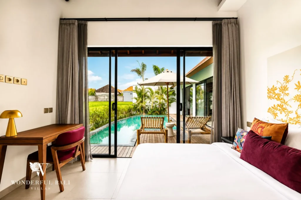 3BR villa for monthly rent Canggu — bedroom with desk and pool view