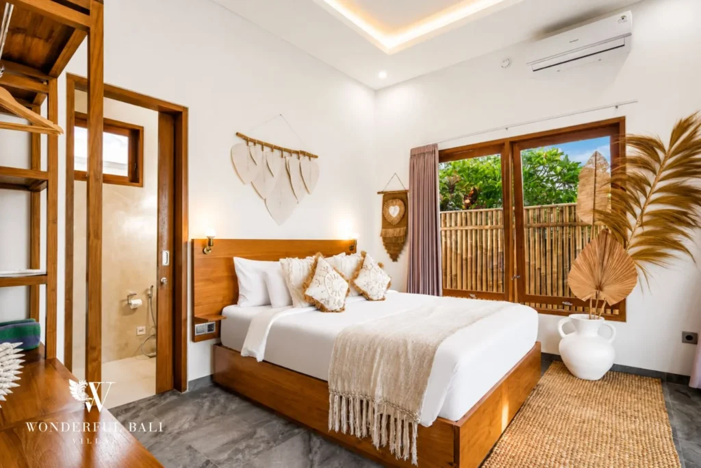 Bedroom with woven decor and garden window at villa in Ubud, Bali