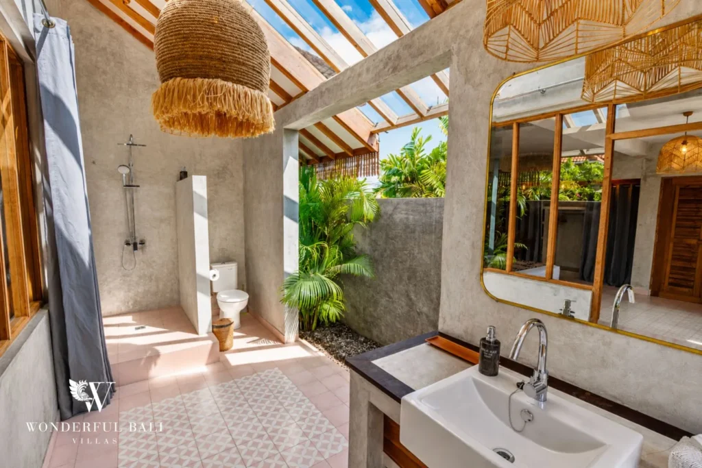 Open-air bathroom with rain shower and skylight at a villa in Canggu, Bali