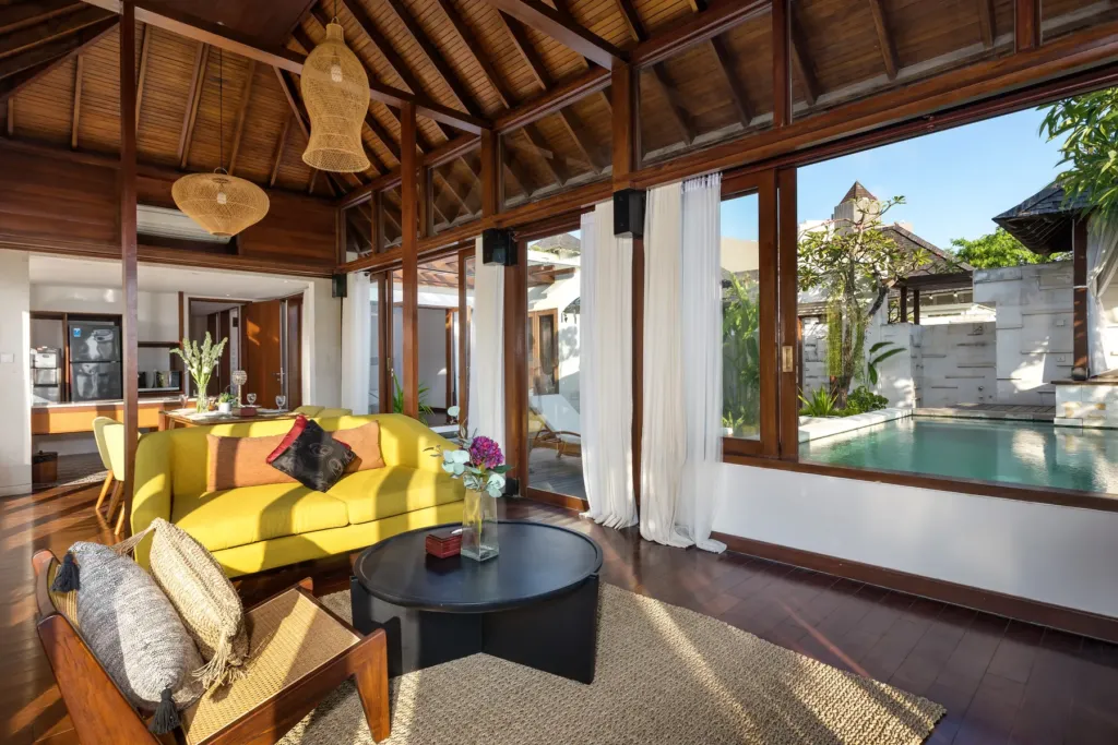 Open-air living pavilion with ocean view at villa in Batu Belig, Bali