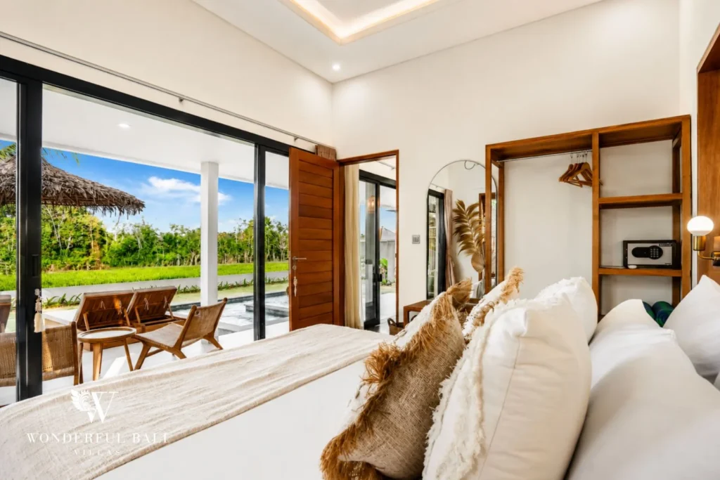 Bedroom opening to a terrace with rice-field view at villa in Ubud, Bali