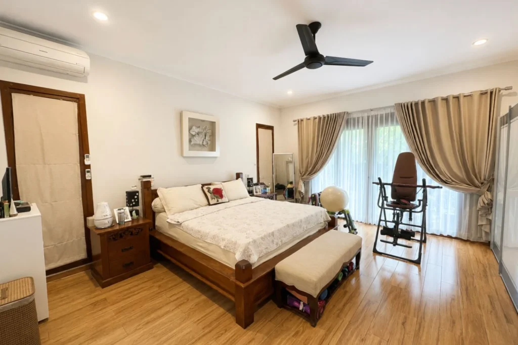 monthly villa rental sanur — bedroom wood floor garden view
