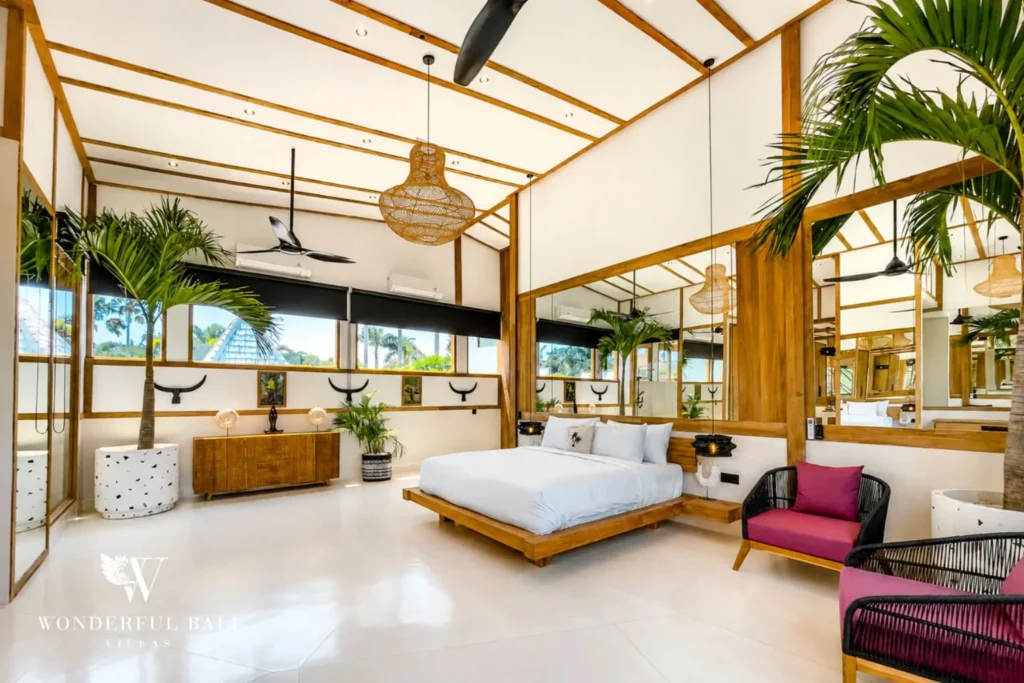 Bedroom with glass walls and pool-garden view at family villa in Umalas, Bali