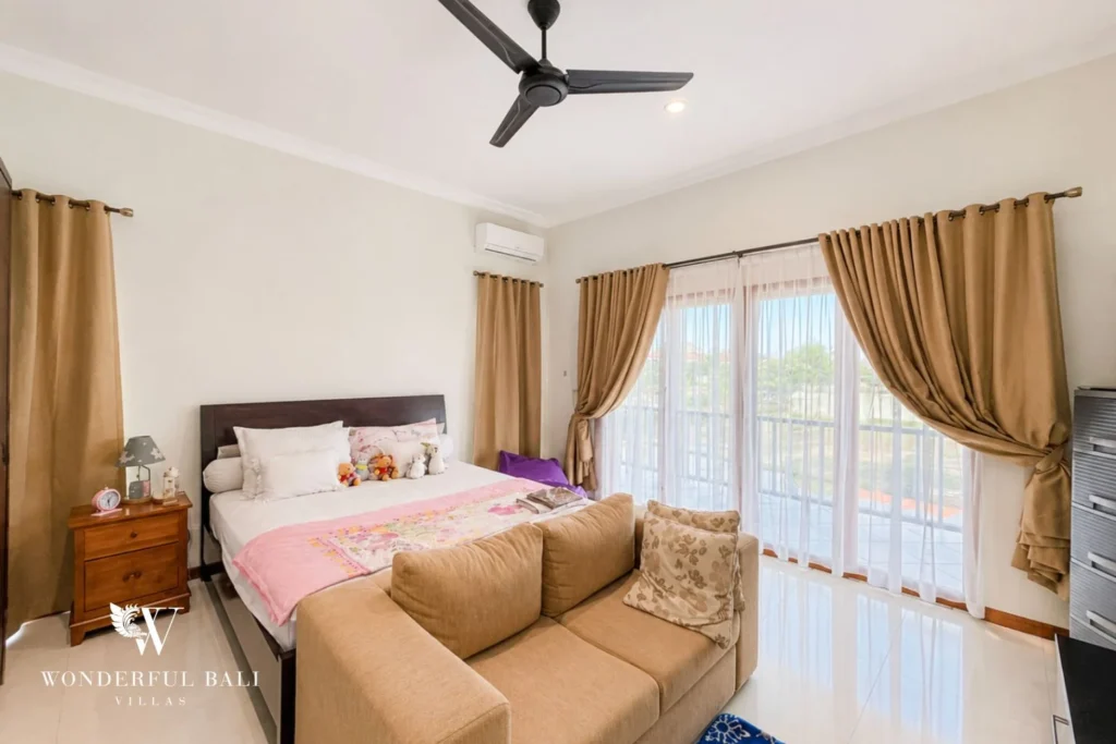 monthly villa rental sanur — bedroom seating garden view