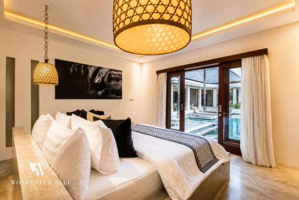 Master bedroom with king bed and sliding doors to the pool at villa in Seminyak, Bali