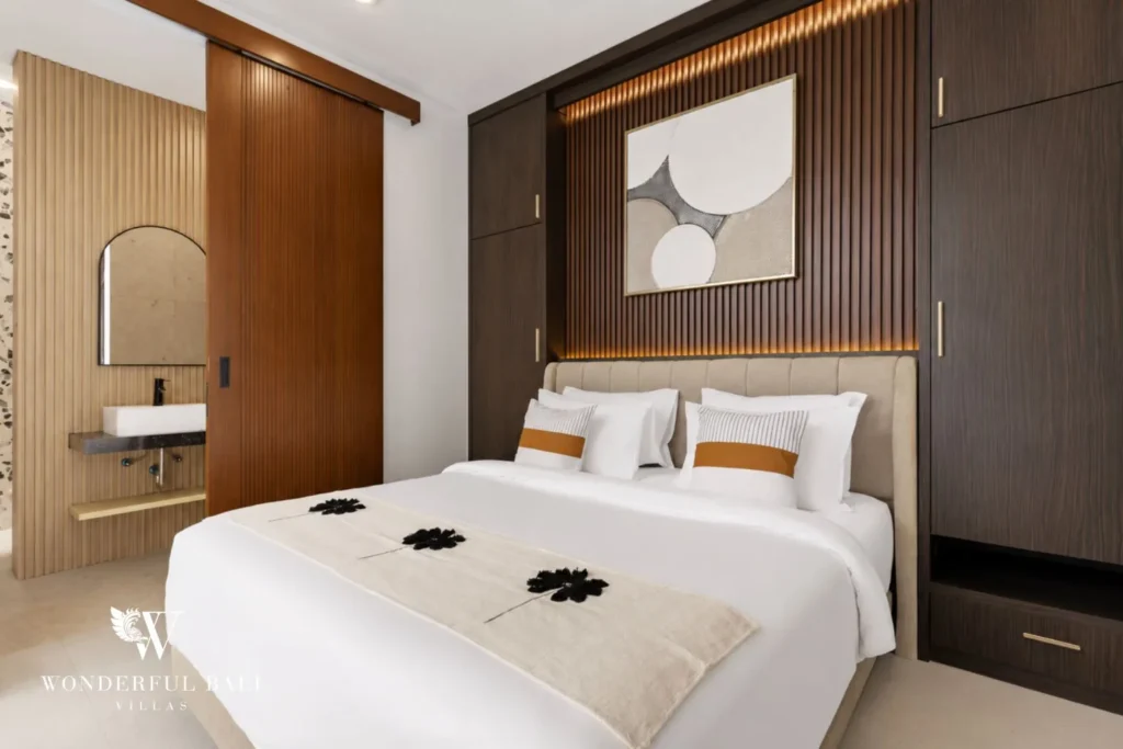 monthly villa rental pererenan — ensuite bedroom with upholstered headboard