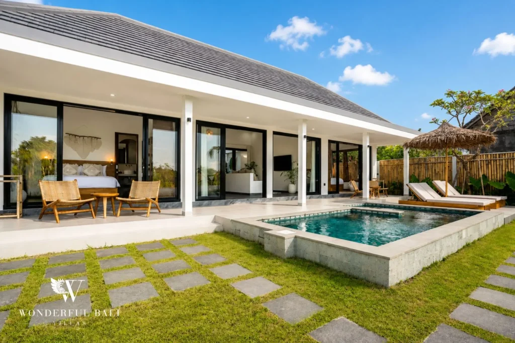 Private pool with garden and sun loungers beside the villa in Ubud, Bali