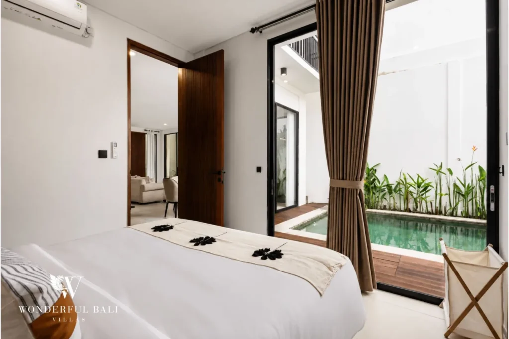monthly villa rental pererenan — bedroom with ensuite bathroom