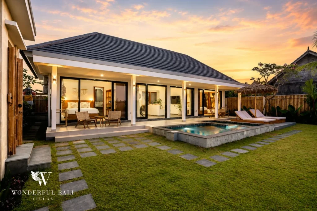 Villa exterior and pool lit at sunset in Ubud, Bali