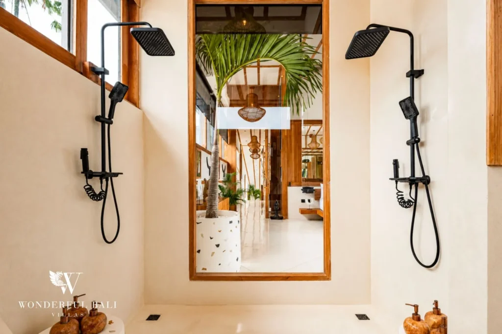 Dual rainfall shower with tropical plants at family villa in Umalas, Bali