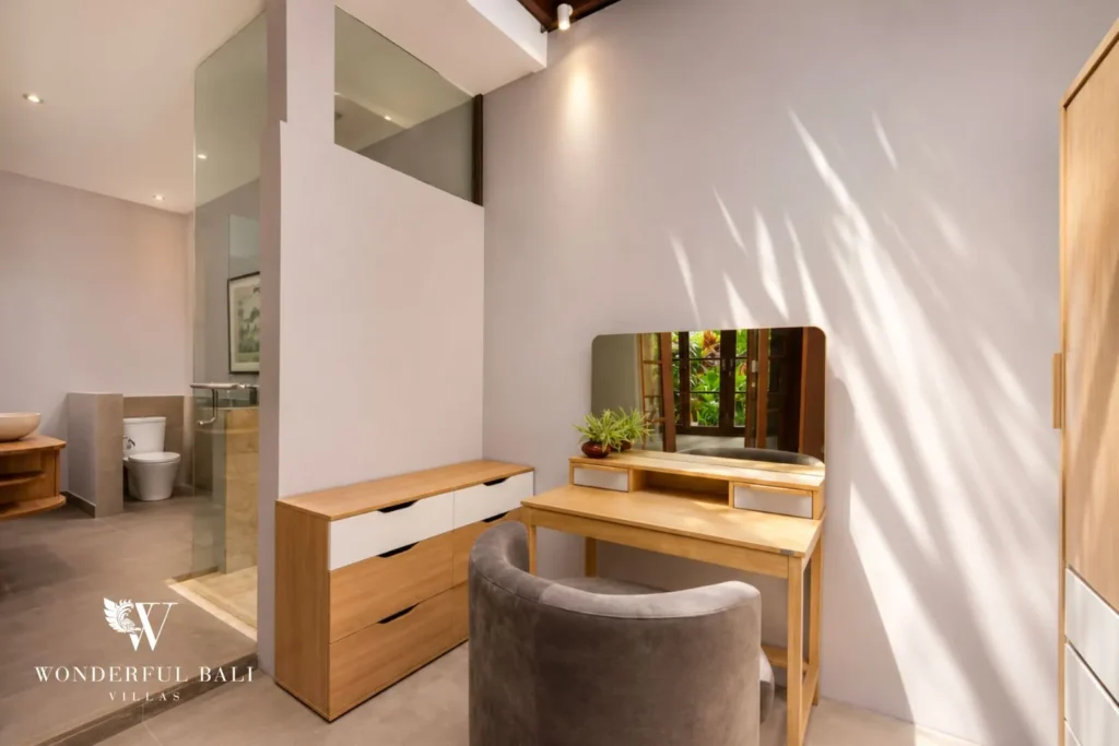 Bedroom with vanity desk, mirror and chair at villa in Umalas, Bali