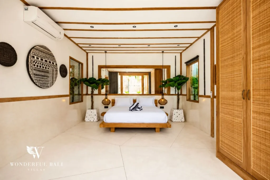 Bright bedroom with open ceiling beams at family villa in Umalas, Bali