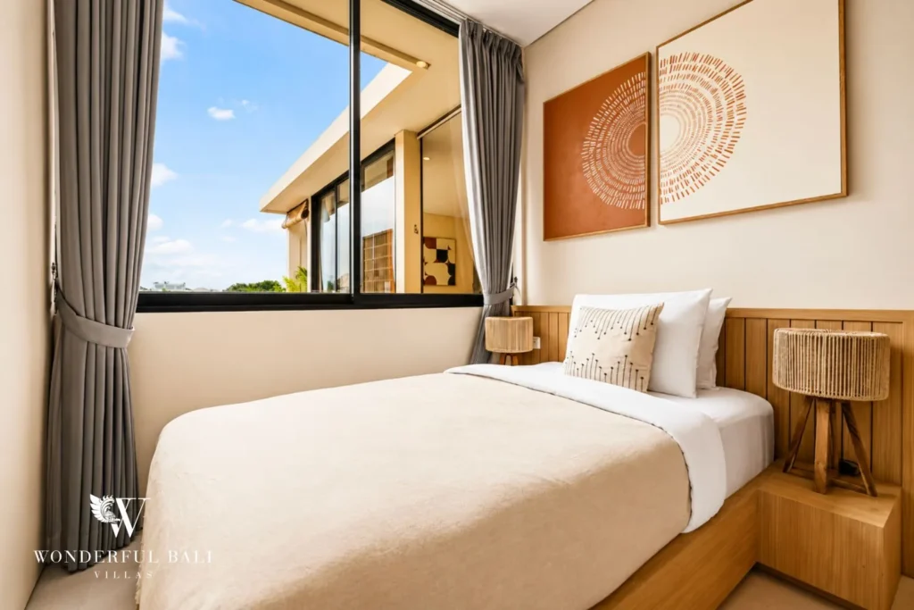 3BR villa for monthly rent Jimbaran — bedroom with framed art and terrace view