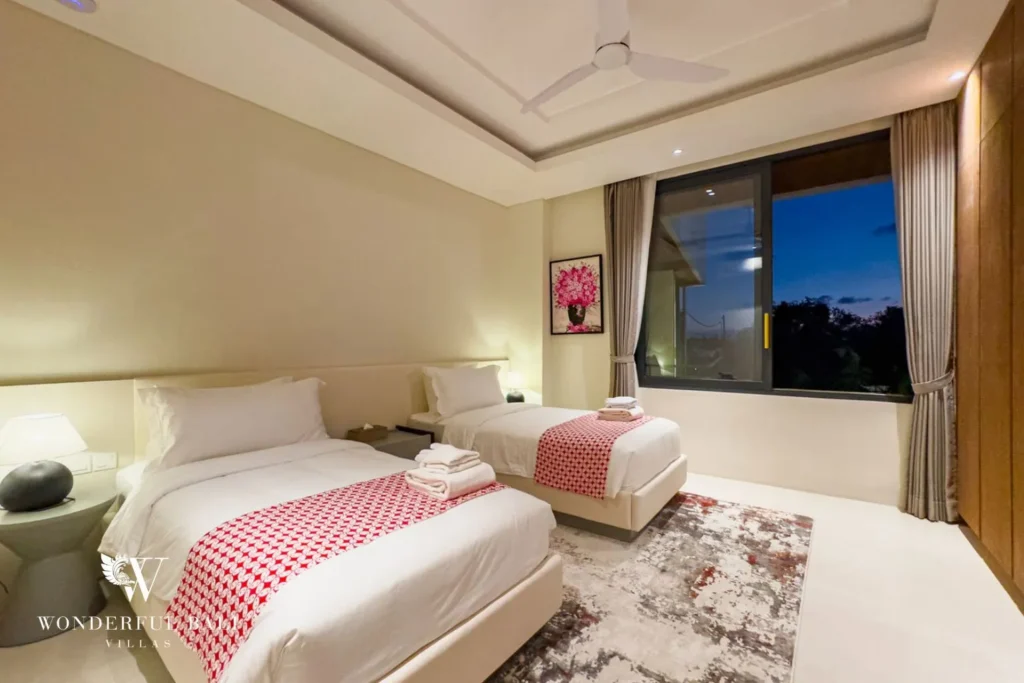 Bedroom with pink decor and soft furnishings at villa in Umalas, Bali