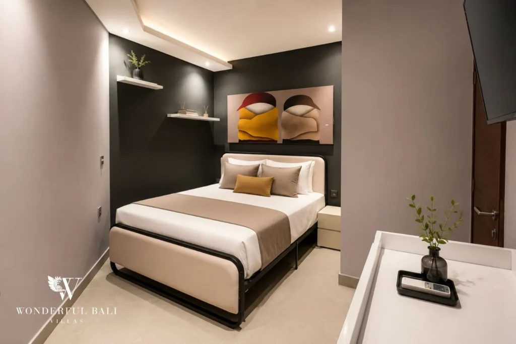 Bedroom with yellow headboard and open ensuite bathroom at villa in Umalas, Bali