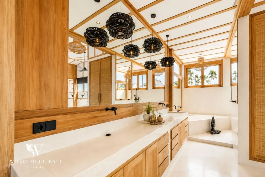 Double-vanity bathroom with woven wall decor at family villa in Umalas, Bali