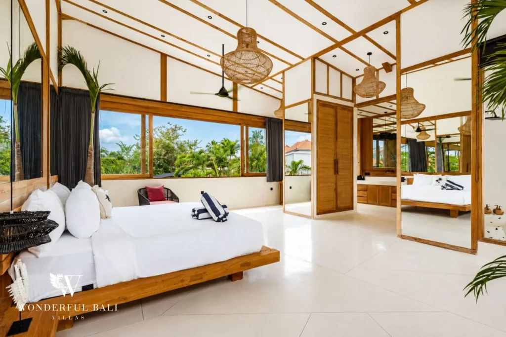 Platform-bed bedroom with garden view at family villa in Umalas, Bali
