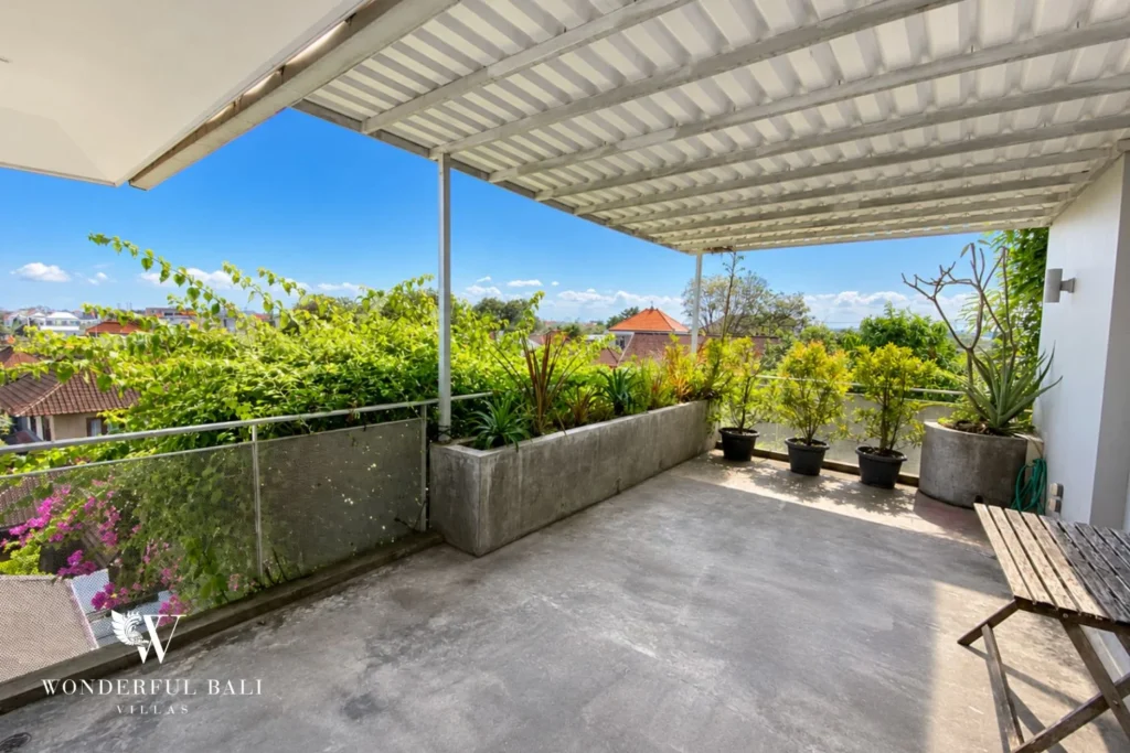 Rooftop terrace with planted border and Umalas neighbourhood view at villa in Umalas, Bali