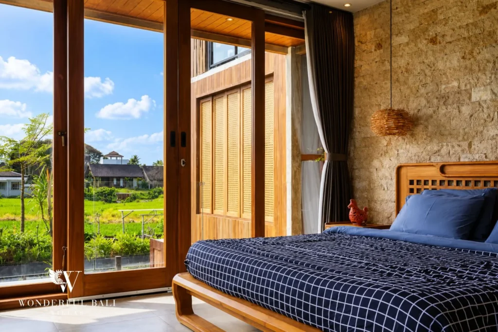 Bedroom with garden outlook at a 4-bedroom ocean-view villa in Seseh, Bali
