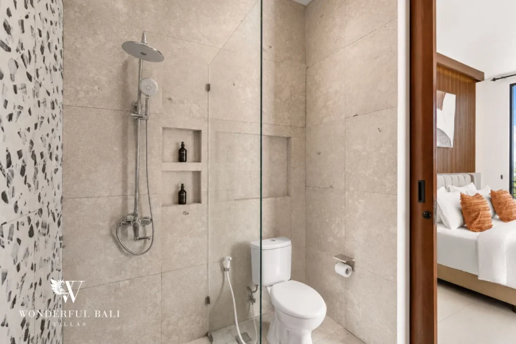 monthly villa rental pererenan — rain shower with terrazzo wall