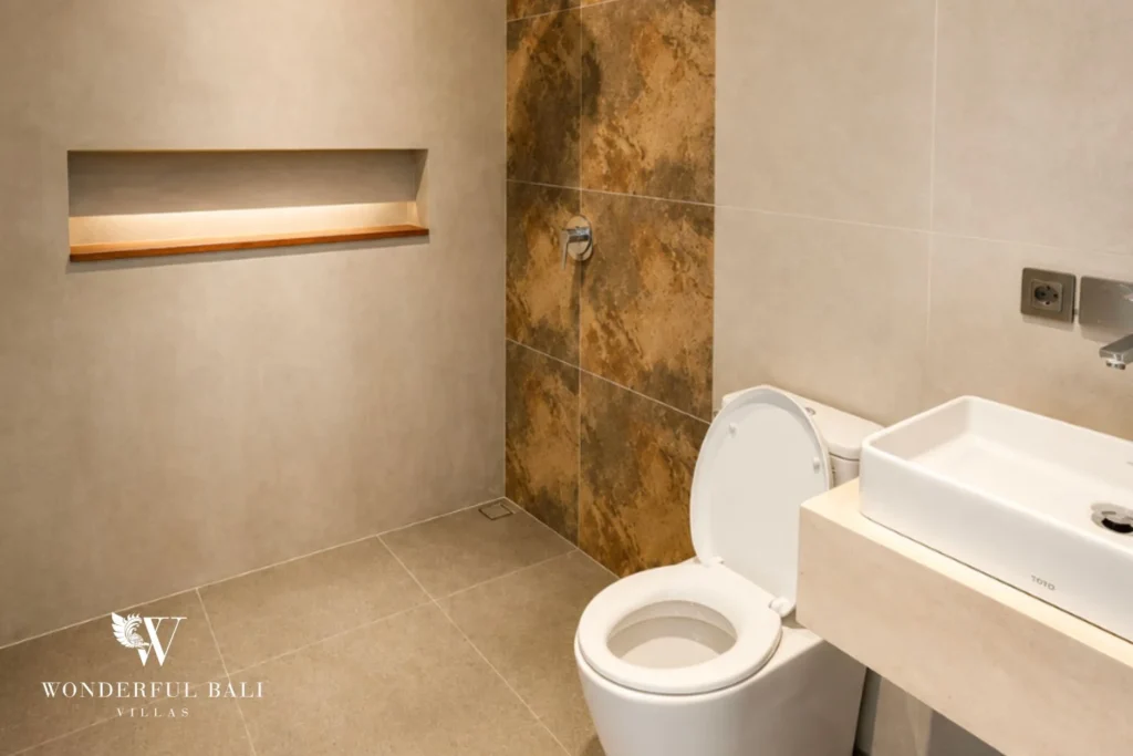 En-suite bathroom at a 4-bedroom ocean-view villa in Seseh, Bali