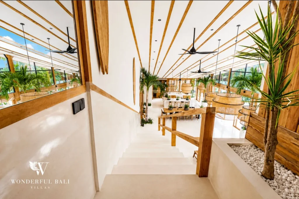 Open bathroom with twin vanity and vaulted ceiling at family villa in Umalas, Bali